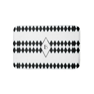 Schwarz-weißes Harlekin-Muster-Monogramm Badematte