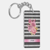 Schwarz-weißes Harlequin mit rosa Blume und Name Schlüsselanhänger (Vorderseite links)