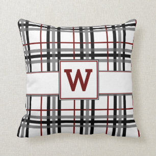 Schwarz-weißes und rotes kariertes Kissen