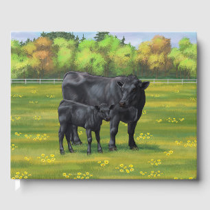 Schwarze Anguskühe und Niedliches Kalb im Sommerwe Gästebuch