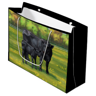 Schwarze Anguskühe und Niedliches Kalb im Sommerwe Große Geschenktüte