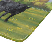 Schwarze Anguskühe und Niedliches Kalb im Sommerwe Schneidebrett (Ecke)
