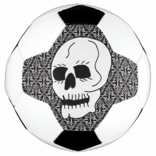 Schwarze Augen des weißen Schädels auf Verziertem, Fußball