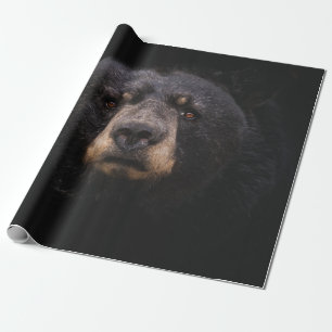 SCHWARZE BEUTEL AUF DER BRANCHE AUS BROWNEN HOLZBA GESCHENKPAPIER