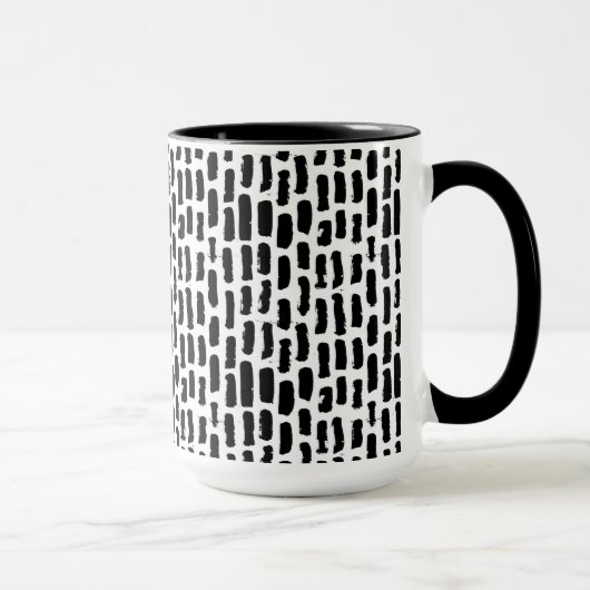 Schwarze Bürste streicht Muster Tasse (Rechts)