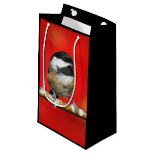 Schwarze Chickade auf Herbstrot Hintergrund Kleine Geschenktüte