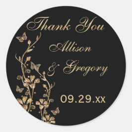 Schwarze, goldene Flora mit Schmetterlingskleber Runder Aufkleber