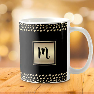 Schwarze goldene Folie, fette Monogramm-Schrift, m Kaffeetasse