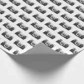Schwarze Kamera, grau Geschenkpapier (Ecke)