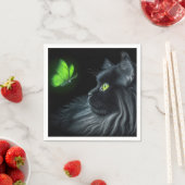 Schwarze Katze, die an einem glühenden grünen Schm Serviette (Beispiel)