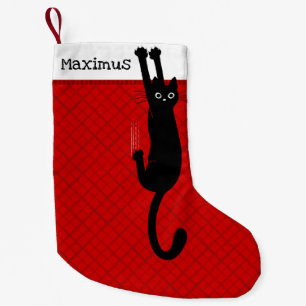 Schwarze Katze hält lustigen Weihnachtsstrumpf fes Kleiner Weihnachtsstrumpf