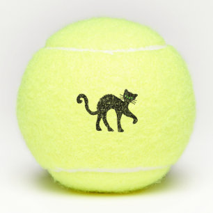 Schwarze Katze hinten Helle grüne Augen Tennisbälle