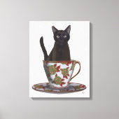 Schwarze Katze im Teacup Leinwanddruck (Vorderseite)