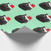 Schwarze Katze mit einer Weihnachtsmannmütze Geschenkpapier (Ecke)