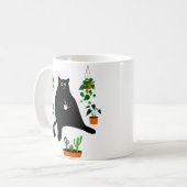 Schwarze Katze mit Pflanze, lustiges schwarzes Kat Kaffeetasse (Vorderseite Links)