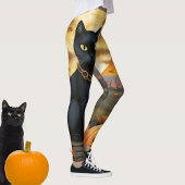 Schwarze Katze unter einem Erntemond und Pumpkins Leggings