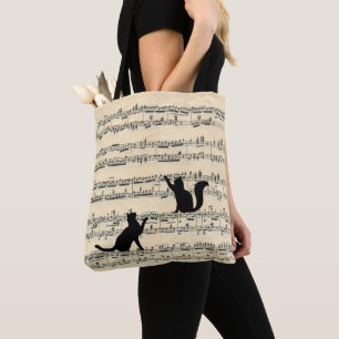 Schwarze Katzen auf Notenpapier Tasche