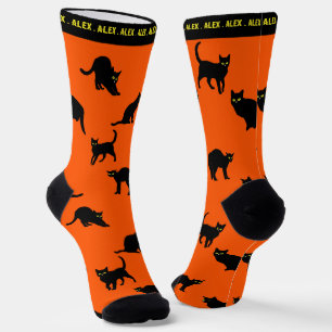Schwarze Katzen auf Orange Socken