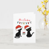 Schwarze Katzen in Weihnachtsmannmützen Frohe Weih Karte (Gelbe Blume)