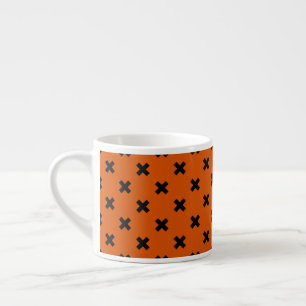 Schwarze Kreuzstiche auf Orange Espressotasse