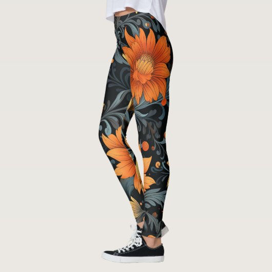 Schwarze Leggings mit lebendigen orangen Blumen (Links)