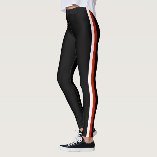Schwarze Leggings mit seitlichem Streifen oder Far (Links)
