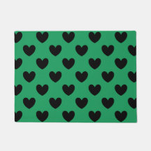 Schwarze Polka Herzen auf Kelly Green