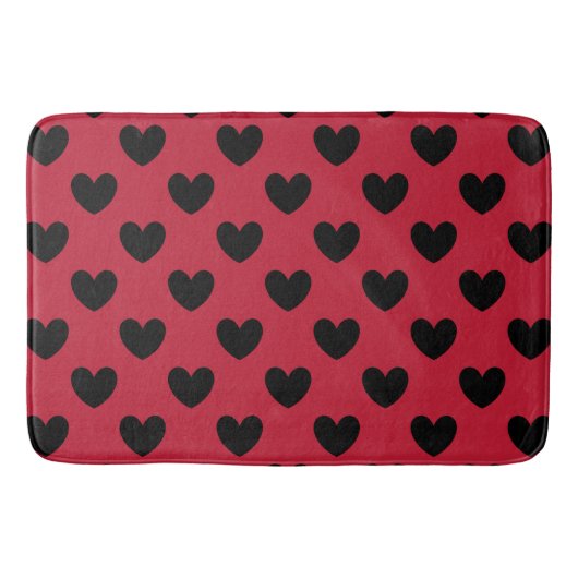 Schwarze Polka Herzen auf rot Badematte (Vorderseite)