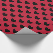 Schwarze Polka Herzen auf rot Geschenkpapier (Ecke)