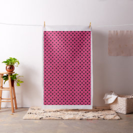 Schwarze Polka-Kreuze auf Fuchsia Stoff