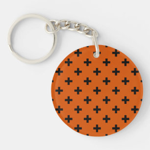 Schwarze Polka-Kreuze auf Orange Schlüsselanhänger
