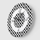 Schwarze Polka Punkte auf der Uhr der weißen Zahle (Winkel)