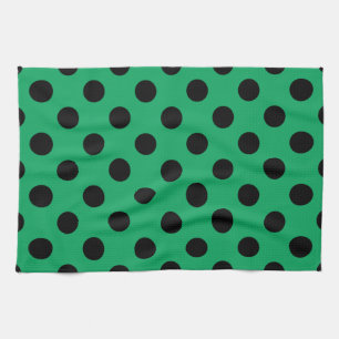 Schwarze Polka Punkte auf frisch grünem Geschirrtuch