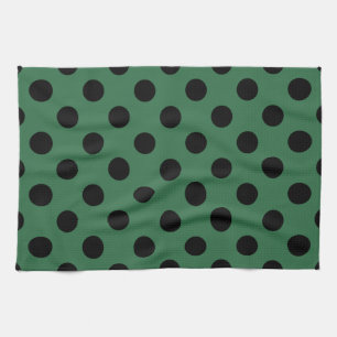Schwarze Polka-Punkte auf kelgrün Handtuch