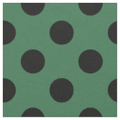 Schwarze Polka-Punkte auf kelgrün Stoff (Nahaufnahme)