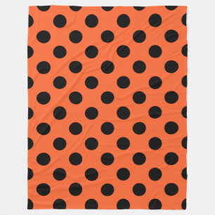 Schwarze Polka-Punkte auf Orange Fleecedecke