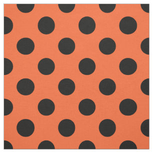 Schwarze Polka-Punkte auf Orange Stoff