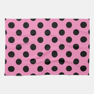 Schwarze Polka-Punkte auf Rosa Geschirrtuch