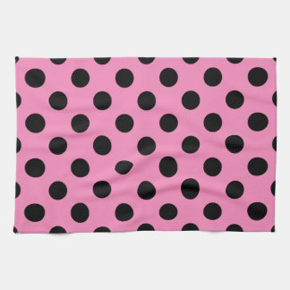 Schwarze Polka-Punkte auf Rosa Geschirrtuch