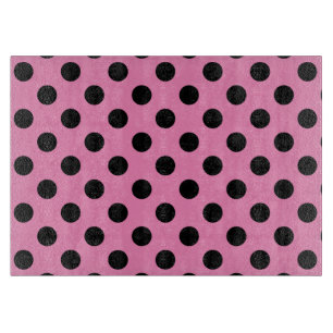 Schwarze Polka-Punkte auf Rosa Schneidebrett