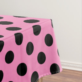 Schwarze Polka-Punkte auf Rosa Tischdecke