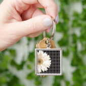 Schwarze Punkte der weißen Blume Schlüsselanhänger (Hand)