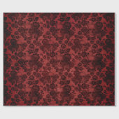 Schwarze Rose und Skulpturen auf Rot Geschenkpapier (Flach)