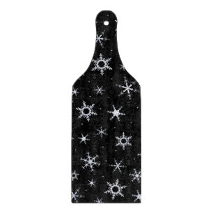 Schwarze Schneeflocken Schneidebrett