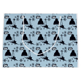 Schwarze Skiausrüstung und Schneeflocken auf blau Große Geschenktüte