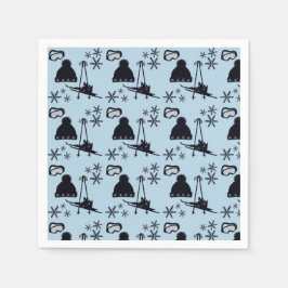 Schwarze Skiausrüstung und Schneeflocken auf blau Serviette