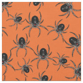 Schwarze Spinnen auf Orange Stoff (Nahaufnahme)