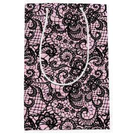 Schwarze Spitze auf rosa Mittlere Geschenktüte