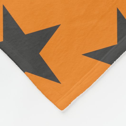 Schwarze Sterne auf Pumpkin Fleecedecke (Ecke)