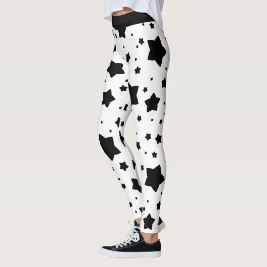 Schwarze Sterne auf Weiß Leggings (Links)